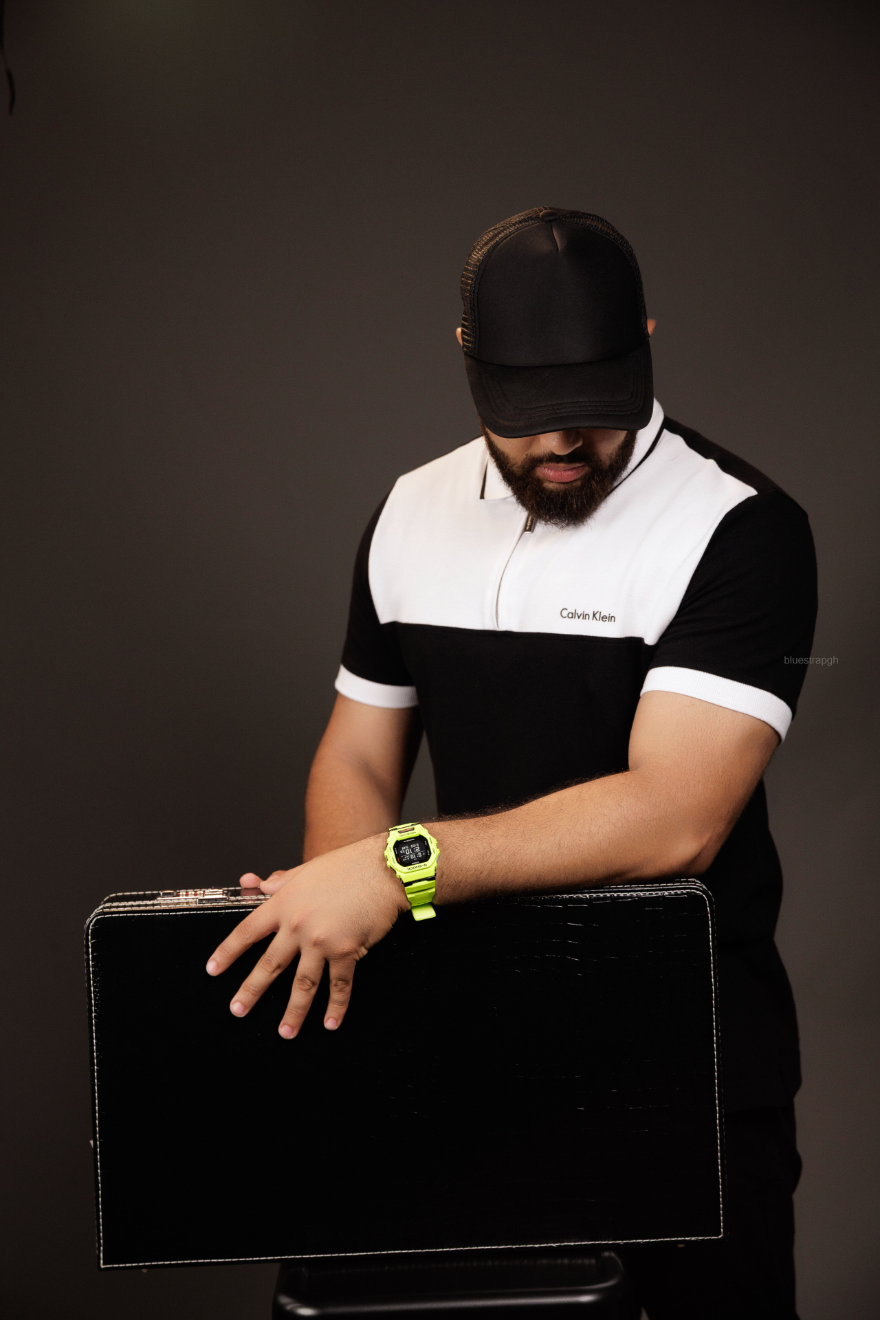 Blue Strap Watches campaign portrait featuring a vivid green wristwatch